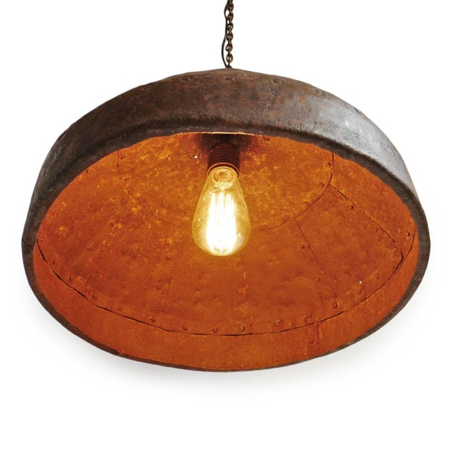Vintage iron pendant formed from hand-riveted panels that create a softly domed silhouette, rich with authentic patina....