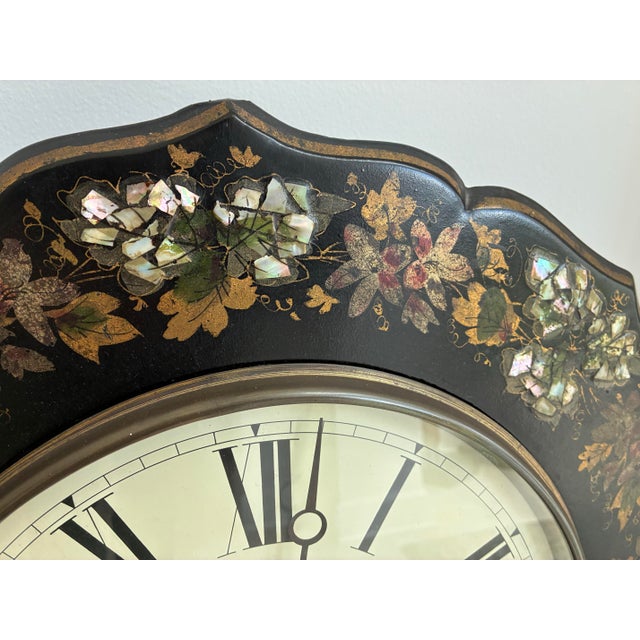 19th Century Victorian papier mache wall clock with decorative inlaid mother of pearl. The clock face alone has a 11.25"...