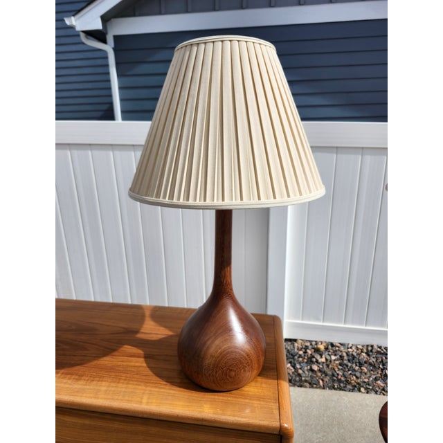 Super cool matching Danish Teak bulb lamps. Includes shades. No makers mark or label.