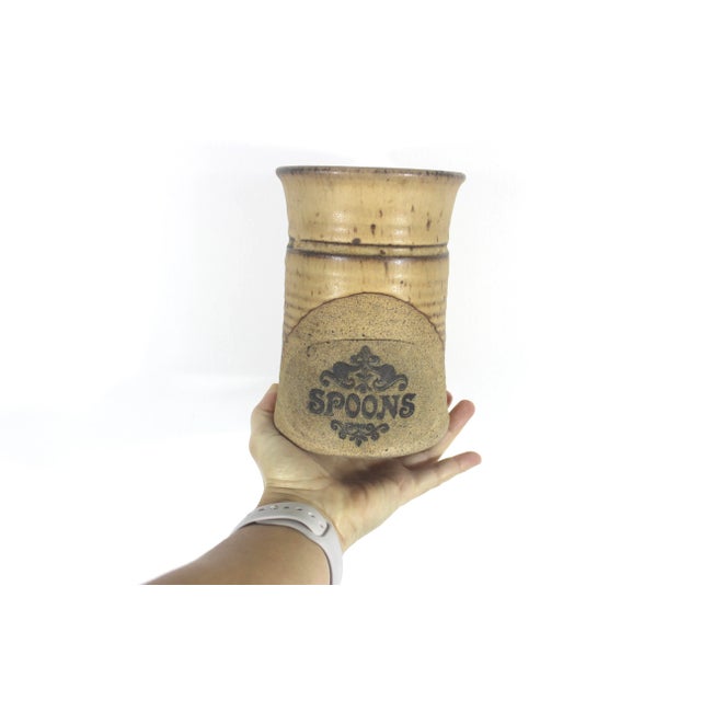 Beautiful and very useful handmade pottery container. Use it by the stove to hold utensils, or as a large vase for spring...