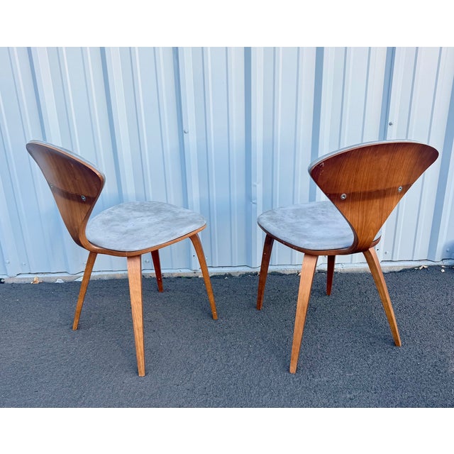Pair of Cherner Chair Company classic side chairs in walnut with gray ultrasuede upholstery. Made in 2006, the frames are...