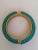 Kenneth Jay Lane Bangle from the 1980's in teal and gold tone. The clasp is a spring clasp. Good for dressy to casual...