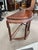 Up for sale is a vintage semi circle console table made from solid rosewood. The table has a nice dark finish that shows...