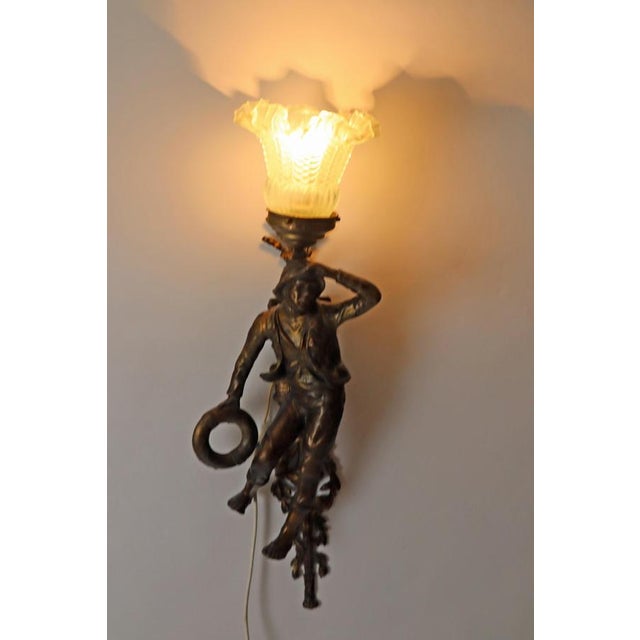 This pair of French lamps is stunning. The first wall lamp is shaped like a beautiful peasant woman. The artistic design...