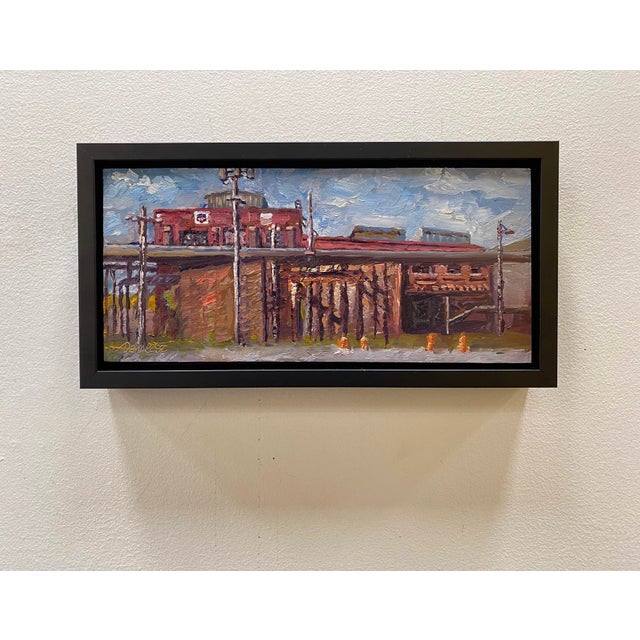 This oil on board painting captures a vibrant industrial scene, showcasing the architectural details of Burnham Yards with...