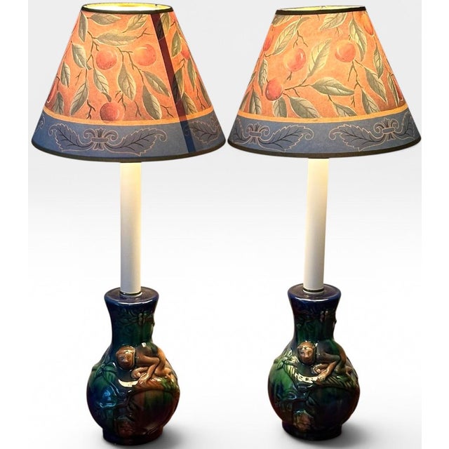 Vintage Majolica Style Glazed Ceramic Monkey Table Lamps - A Pair Bring a captivating element of playful sophistication...