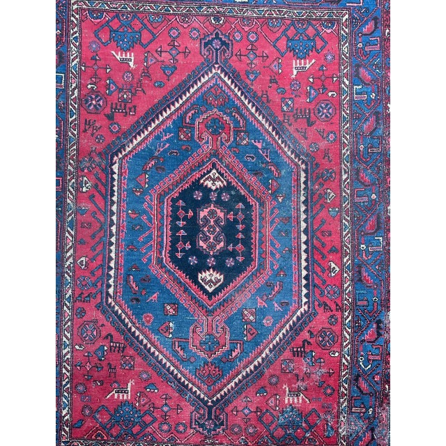 This well-worn Hamadan rug from the mid-20th century is a true testament to its history. Meticulously hand-knotted at...