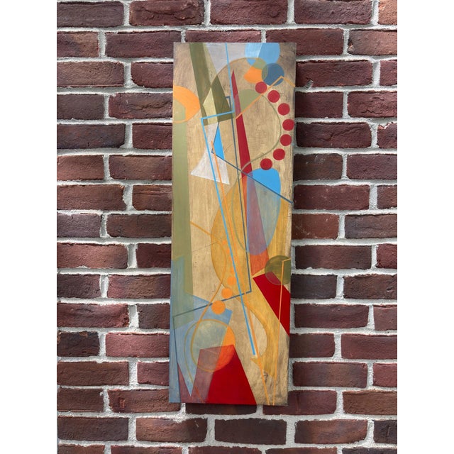 This artwork features a dynamic interplay of geometric shapes and vibrant colors, creating a sense of movement and energy....
