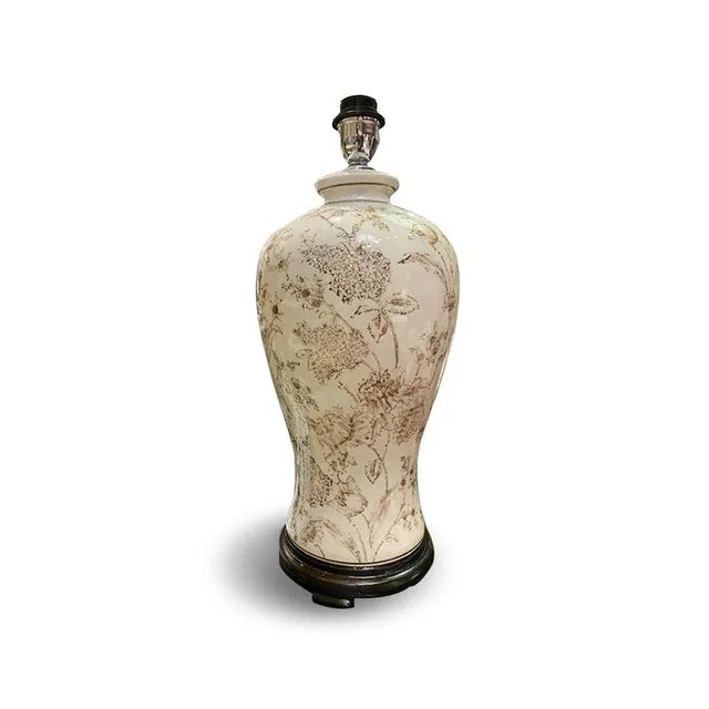 Rounded Taupe vase lamp is delightful with the taupe print pattern. The contrast is sharp on a walnut base with a rounded...