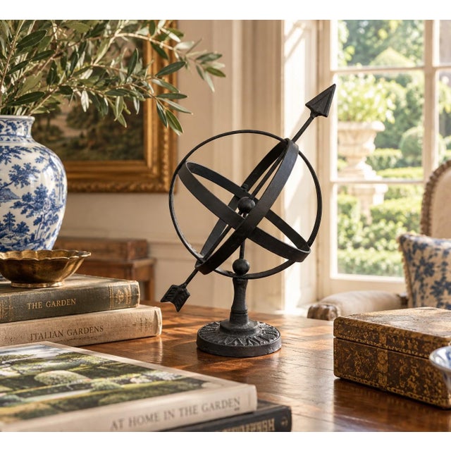 A beautifully crafted iron armillary sphere, evoking the timeless elegance of classical European gardens. Pieces like this...
