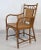 These vintage rattan and bamboo arm chairs perfectly blend mid-century organic design with timeless coastal appeal....