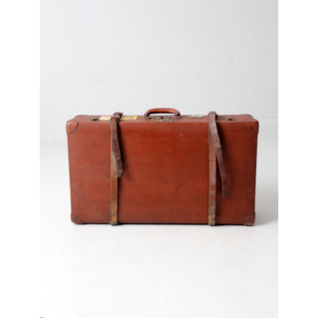 This vintage brown Atka Unica Vulkanfiber suitcase (circa 1940s–1960s) features original leather straps, brass closures,...