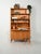 Scandinavian elm bookcase from the 1930s and 1940s with open shelves, a drop-leaf desk, internal compartments, and a base...