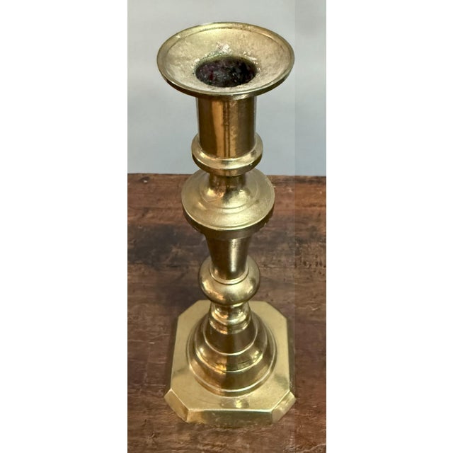 Set the mood, 1860s-style. This pair of antique English brass candlesticks brings just the right mix of history and glow...
