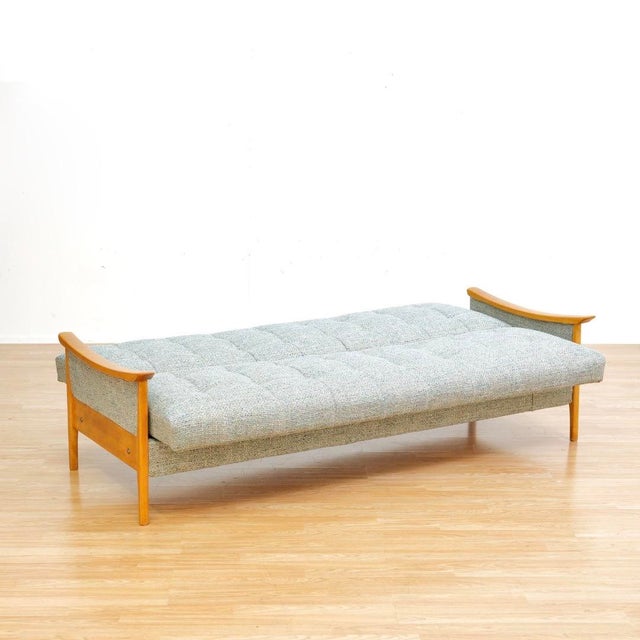 This mid-century daybed sofa by Jentique Furniture.&nbsp; Produced in England during the 1960s, the vintage oak frame has...