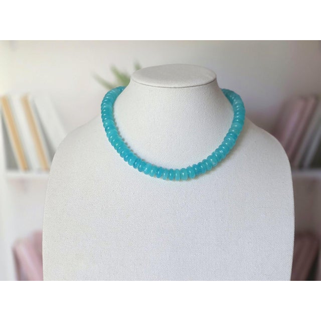 Length: 18.5 inches (47 cm) Bead Shape: Rondelle Bead Size: 12–12.5 mm Weight: 103 grams This exquisite necklace is...