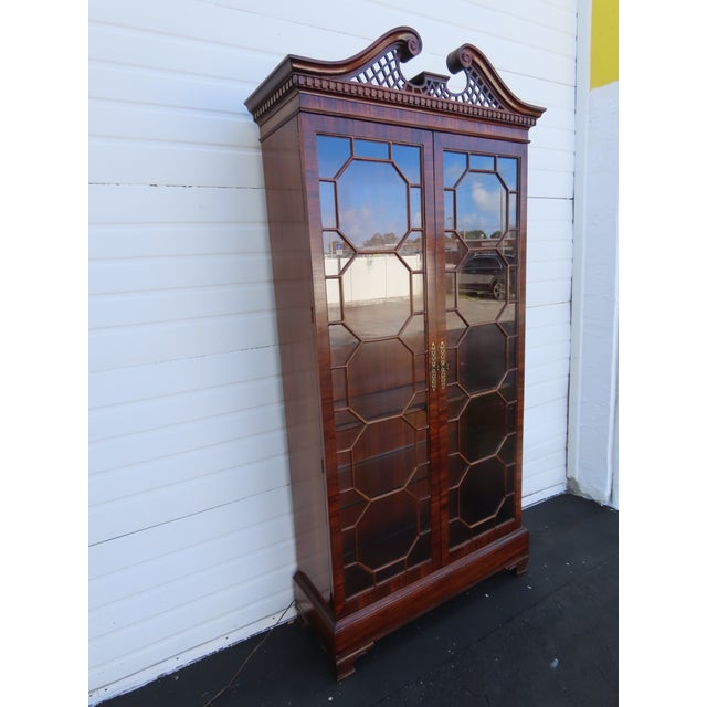 This beautiful China Cabinet is made of wood, solid wood, solid mahogany, Flame mahogany, veneer, and glass. It was made...
