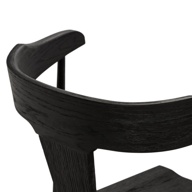 A fresh, counter-height take on mid-century Windsor seating, featuring a bowed, sculptural silhouette and soft black...
