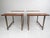 This stylish two-tone pair of vintage modern end tables feature a brass sled leg base. A unique piece that boasts a white...
