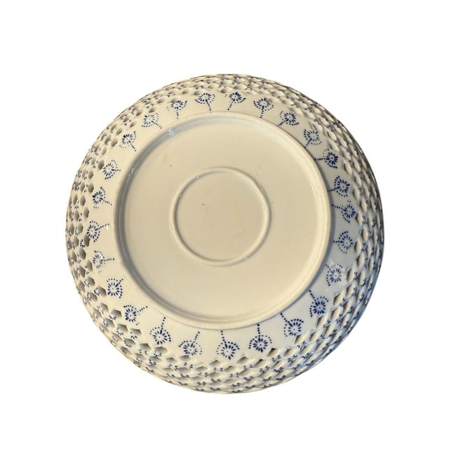 Blue and White Floral Lattice Bowl With Scalloped Edge The manufacturer is unknown, but the quality is notable.