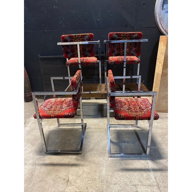 This is a set of four modular framed chrome chairs upholstered in Teimani red upholstery. They measure 31" high x 21" wide...