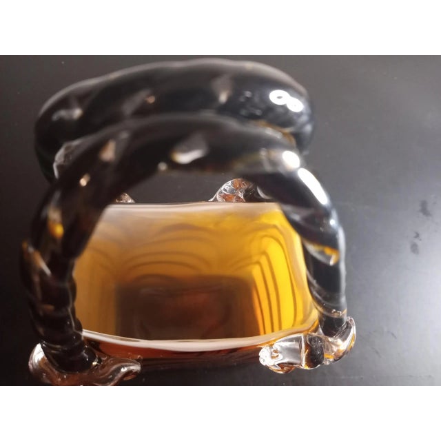 This is an Art Glass Safari Glaze Purse Vase. Procured it at an auction