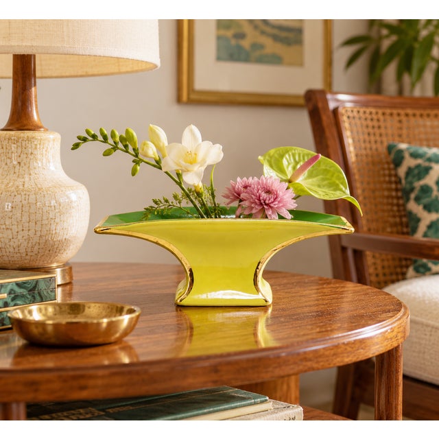 Unusual Mid-Century Modern ceramic footed bowl featuring a vibrant chartreuse yellow exterior, contrasting green interior,...