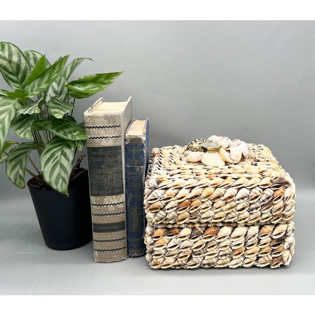Wonderful vintage box handcrafted from hundreds of natural seashells and marked "Product of the Philippines." The box is...