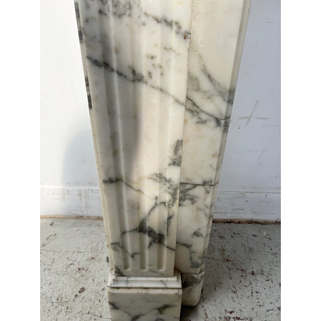 Louis xvi style fireplace in white veined carrara marble two straight jambs with recessed fluting fluted frieze and...