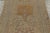 Hand-knotted in wool, this 4x6 Vintage Turkish Anatolian Prayer Rug, circa 1950–1959, presents a soft ivory and golden...
