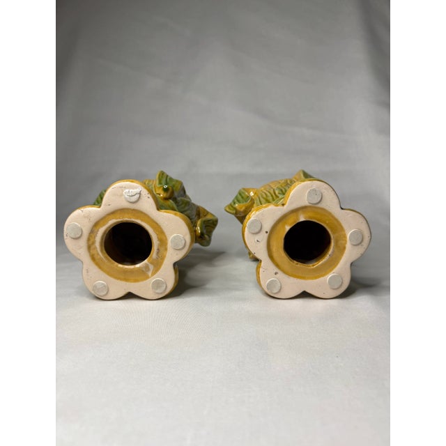 A pair of vintage majolica style ceramic pillar candle holders bring a naturalistic style to your table. Vibrant painted...
