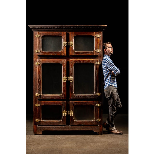 Antique wooden icebox with matching oak interior paneling. This was top of the line food storage at the turn of the...