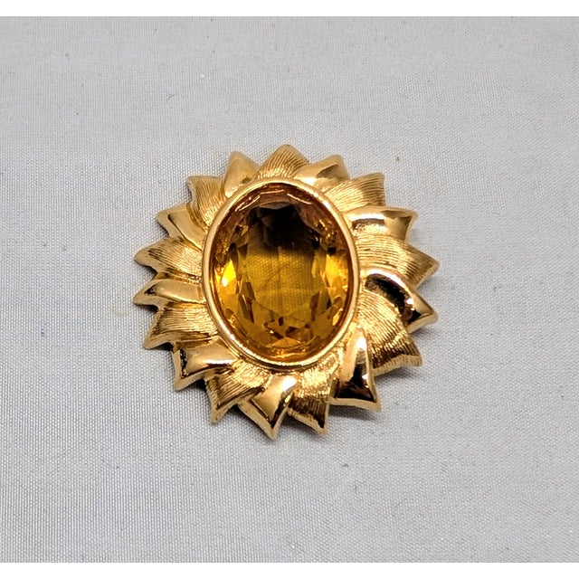 1990s or early 2000s goldtone oval unfoiled open backed faux-citrine flower with alternating textured and smooth petals...