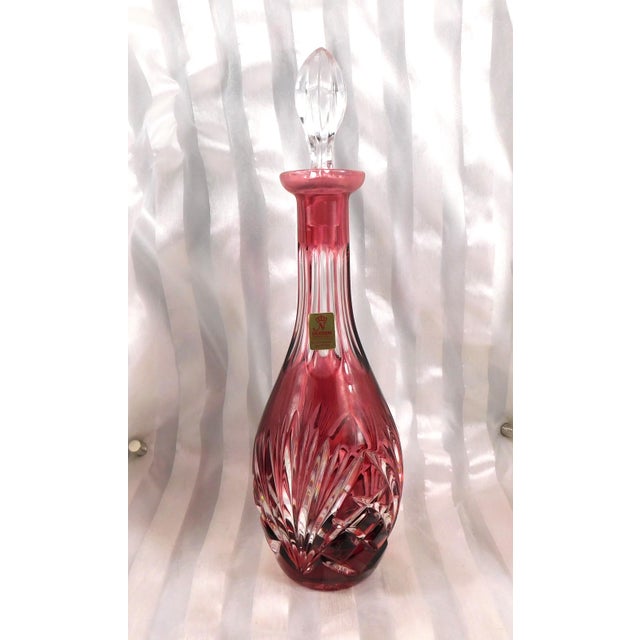 This is a pink cut to clear decanter by Nachtmann in the Nierstein pattern (I think) from 1965. The decanter is pink cut...