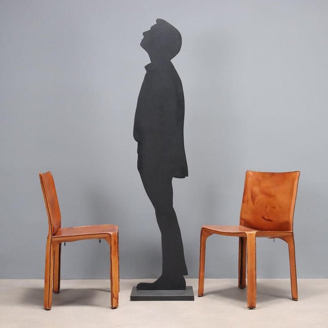 Two chairs with metal frames and leather upholstery. In good overall condition with some signs of wear, as shown in the...