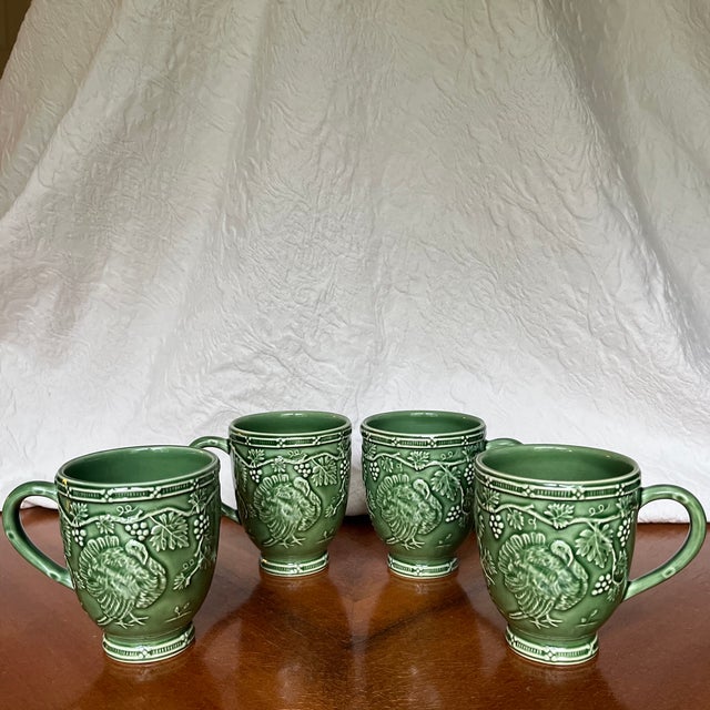 Vintage set of four Bordallo Pinheriro mugs. This pattern features an embossed relief of a harvest turkey in green...