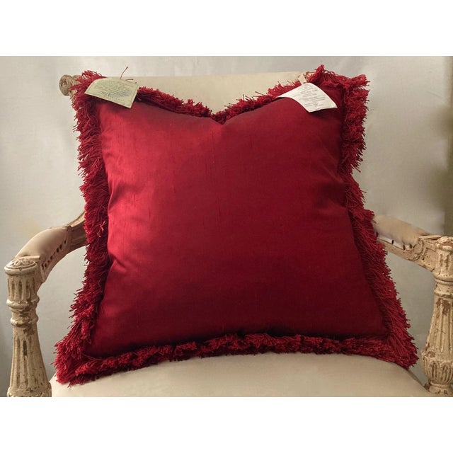 Ruby red Dupioni silk decor pillow. Designed with color matching full eyelash trim and hidden zipper. Luxurious feather...