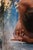 This artwork presents a figure in a dynamic, contorted pose, captured in a moment of introspection and release. The smooth...