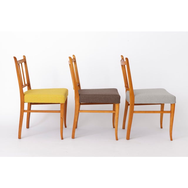 Set of four vintage dining chairs made of solid beechwood, dating from the 1950s–1960s. Manufacturer unknown, most likely...