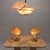 Very beautiful set of two table lamps and one pendant. This exceptional set is fabricated in the 70's in Italy. The hand...