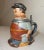 This beautiful lidded stein is a true collector's item for any breweriana enthusiast. Hand-painted with intricate details,...