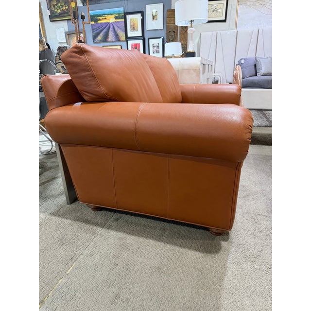 A refined blend of comfort and classic American craftsmanship, this Ethan Allen “Conor” Rust Leather Loveseat offers...