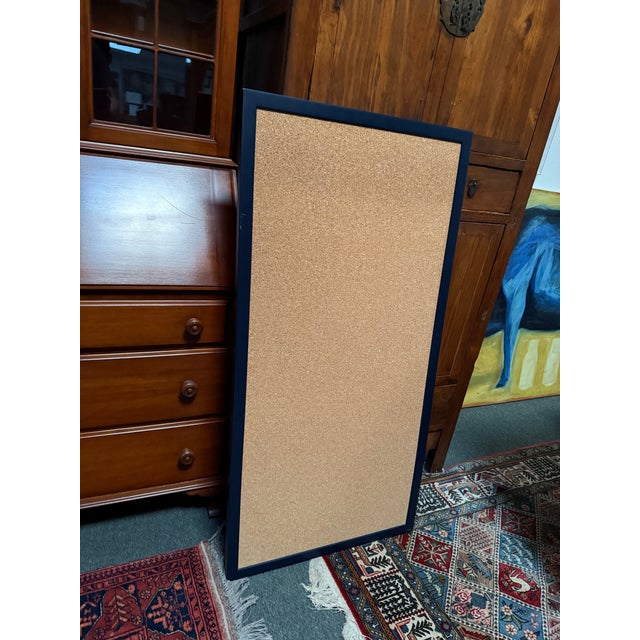 Design Plus Gallery presents a Framed Cork Bulletin Board. Simply stylish, the tall rectangular cork bulletin board has a...