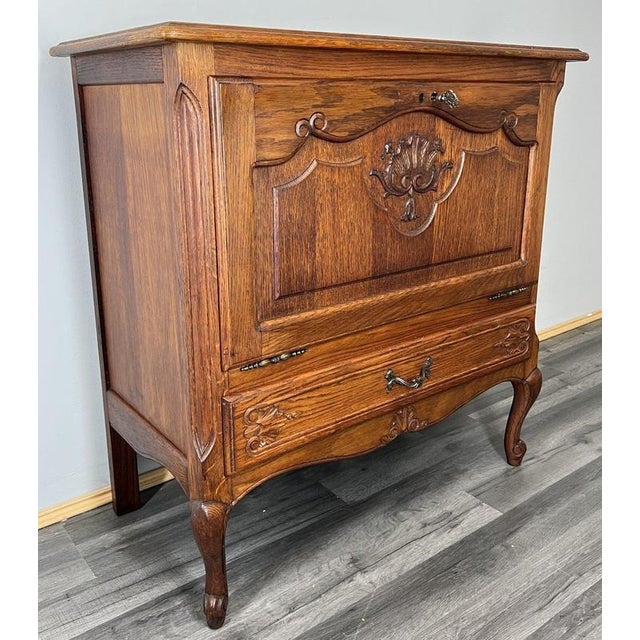 This charming Vintage French Louis cabinet is a compact and characterful piece, displaying classic Louis-style carved...