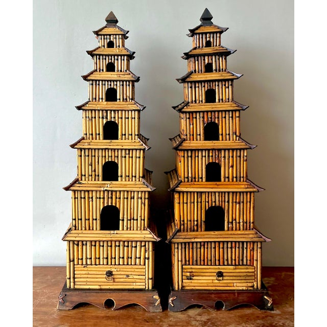 Presenting a magnificent pair of vintage Asian rattan pagodas, exuding a serene yet commanding presence. These beautifully...