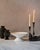 The Medium Handcrafted Ceramic Pedestal Bowl by NPage Studio X Lostine is a sculptural decorative vessel that blends...