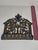 This is an exceptional example of a traditional Eastern European "bench-type" Hanukkah lamp. The backplate is an intricate...