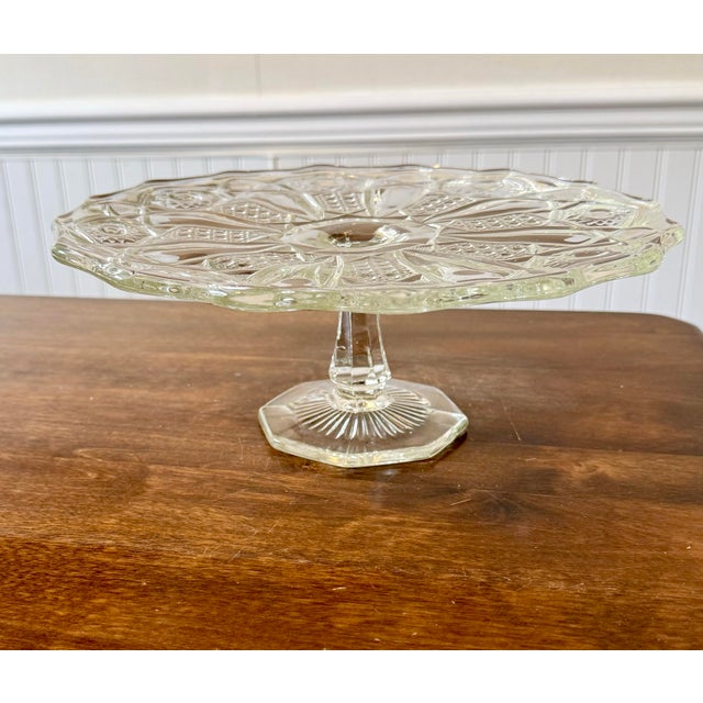 This cake stand is durable and decorative featuring the distinctive “Quintec” pattern by L. E. Smith Glass Co. Its design...