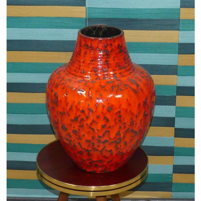 Fantastic decoration! A particularly vibrant, bulbous floor vase Bold 1970s design in a radiant orange-red glaze Sturdy,...