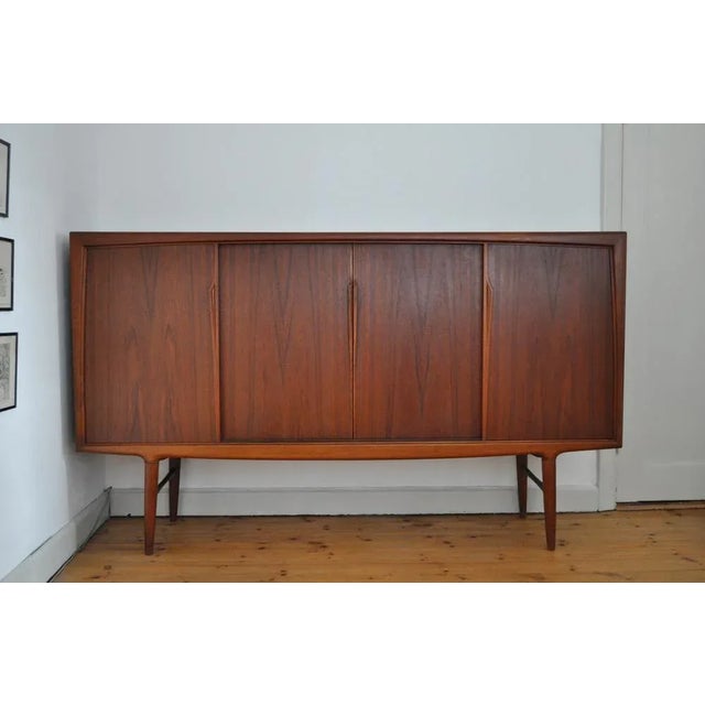 Rosewood sideboard by Axel Christensen for ACO (Axel Christensen Odder) in the 60s. Beautiful organic design with very...